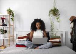 full-shot-woman-holding-laptop-scaled